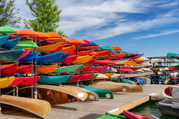 Colorfull canoes and kayaks on boardwalk in Toronto harbourfront, Ontario, Canada