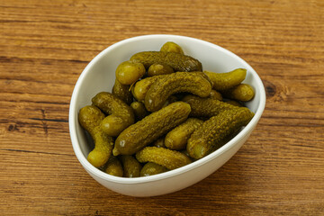 Pickled gherkin in the bowl