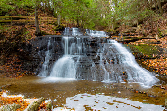 Hells Hollow Falls close up with hemlock trees surrounding.