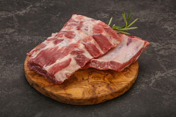 Raw pork ribs served rosemary