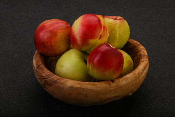 Sweet small nectarines in the basket