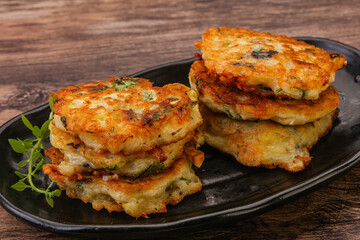 Zucchini pancakes with herbs and spices