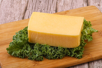 Tasty yelloow Tilsiter cheese brick