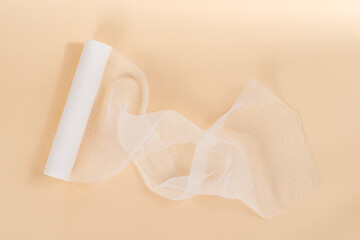 White Bandage isolated on beige background.