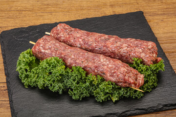 Raw minced beef kebab skewer
