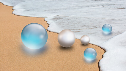 Blue colored crystal ball and a pearl by the sea