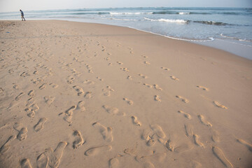 Goa/ India 09 November 2020 Footprints of Indian crowd of people on the sand at Baga Beach Goa