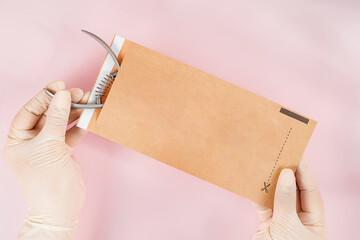 packing a manicure tool in kraft packages before sterilizing in a dry oven.