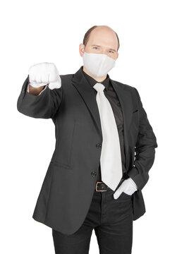 Handsome young business man with virus protection white mask offer fist in glove for handshake .