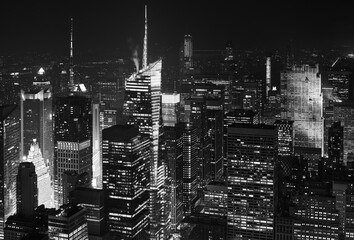 Black and white aerial photo of Manhattan night cityscape, New York, USA.
