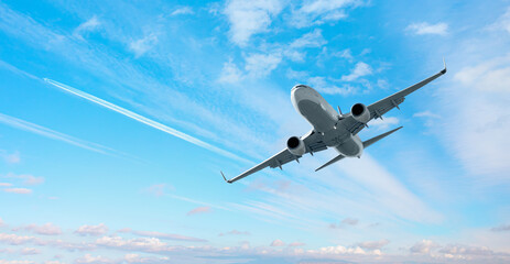 White passenger airplane over the clouds  - Travel by air transport