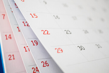 Calendar page flipping sheet close up on office table background business schedule planning appointment meeting concept