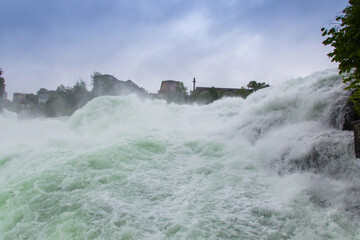 Naklejka na ściany i meble The Rhine Falls in Switzerland. Rheinfall is the biggest waterfall in Europe