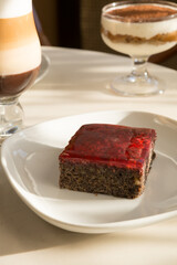 Piece of cake served with coffee