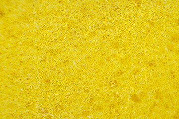 Yellow porous soft sponge background