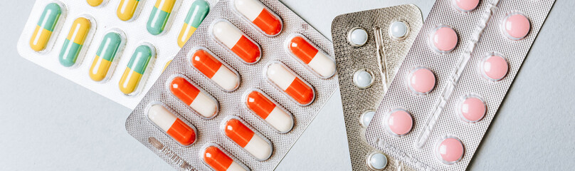 Medical concept flat lay with pills on a blue background