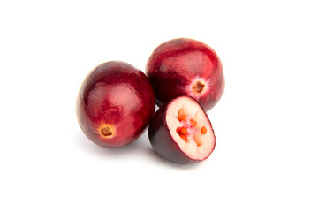 Halves and whole fresh red fall cranberries isolated on white