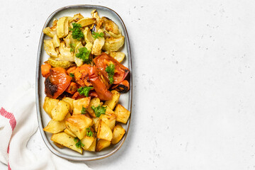 Oven baked various colorful vegetables. Top view, space for text.