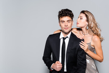 elegant young couple posing isolated on grey, stock image