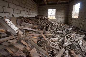 Firewood in barn in abandoned village of Chernobyl zone