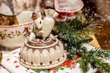 Christmas cute decoration of the table for a children's party, selective focus. Beautiful table setting for the celebration of New Year and Christmas.