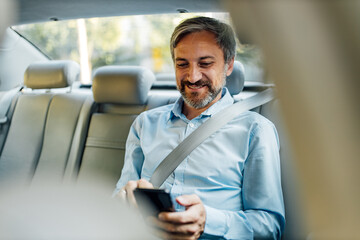 Man sending an email over the phone.