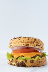 Fresh tasty burger isolated on marble background