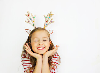 beautiful girl Santa deer, in a red sweater for Christmas and New Year's gift. Have a happy little girl on a white background banner. Girl rejoices and waits for gifts