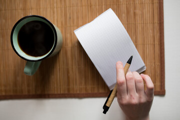 notebook and pen on the table