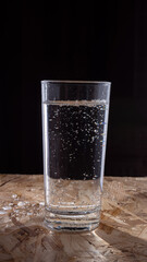 sparkling mineral water is poured in a glass