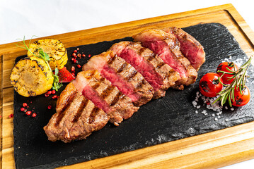  Juicy steak medium rare beef with spices and vegetables