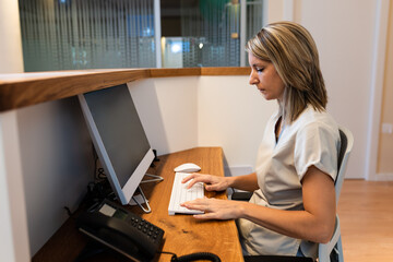 young woman at the reception of fitness club or health centre