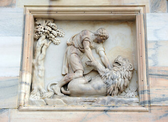 Samson fighting the lion. Cathedral of Milan (Duomo di Milano). Milan, Lombardy, Italy
