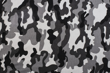 Fabric with spots like earth or grass to blend in with the environment, fabric with a pattern like a soldier's military uniform, place for text