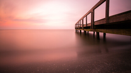 Long exposure of Sulina beach pier at dawn - Romania