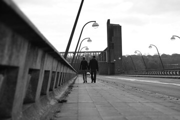 couple walking on the bridge