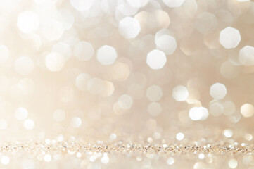 Gold, beige light brown abstract light background, Golden shining lights, sparkling glittering Christmas,new year lights. Blurred abstract holiday background.