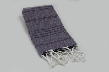 Peshtemal Turkish bath cotton towel folded textile. Beautiful bright colors with natural light background. Perfect online market digital shop sales.