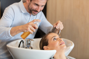 close up of a beautiful young woman enjoying head massage