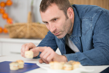 man preparing tapas for his friends