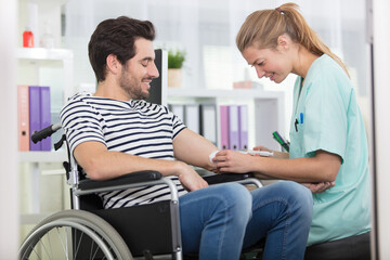 positive doctor and patient on wheelchair