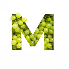 Letter M of English alphabet of fresh grape and cut paper isolated on white. Typeface of green berries