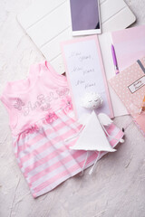 set of woman  plans  at new year with angel and child dress. life  style concept. flat lay