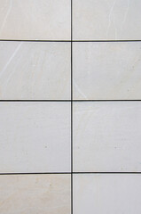 bright smooth modern sandstone facade with an regular pattern. High quality photo