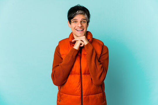 Young caucasian skinny man expressing emotions isolated on blue background