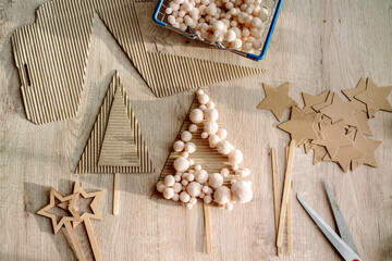 Kid is holding a Christmas tree decoration in his hands.zero waste