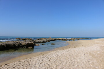 Fototapeta na wymiar Mediterranean coast with stones Israel Netanya