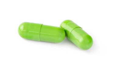 Close-up Two Herb powder capsules isolated on white background.