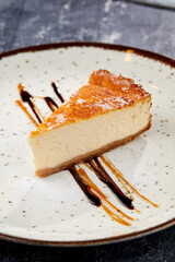 tasty cheesecake with chocolate sauce