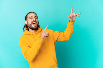 Young man with long hair look dancing and having fun.